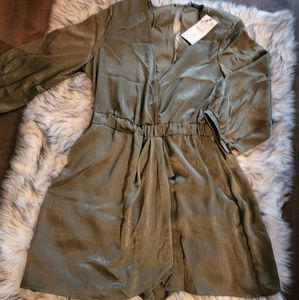 One piece shorts jumper, has shoulder pads. Deep V in the front and back.